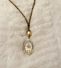 Load image into Gallery viewer, Bronze Gold Mary Necklace with clear swarovski
